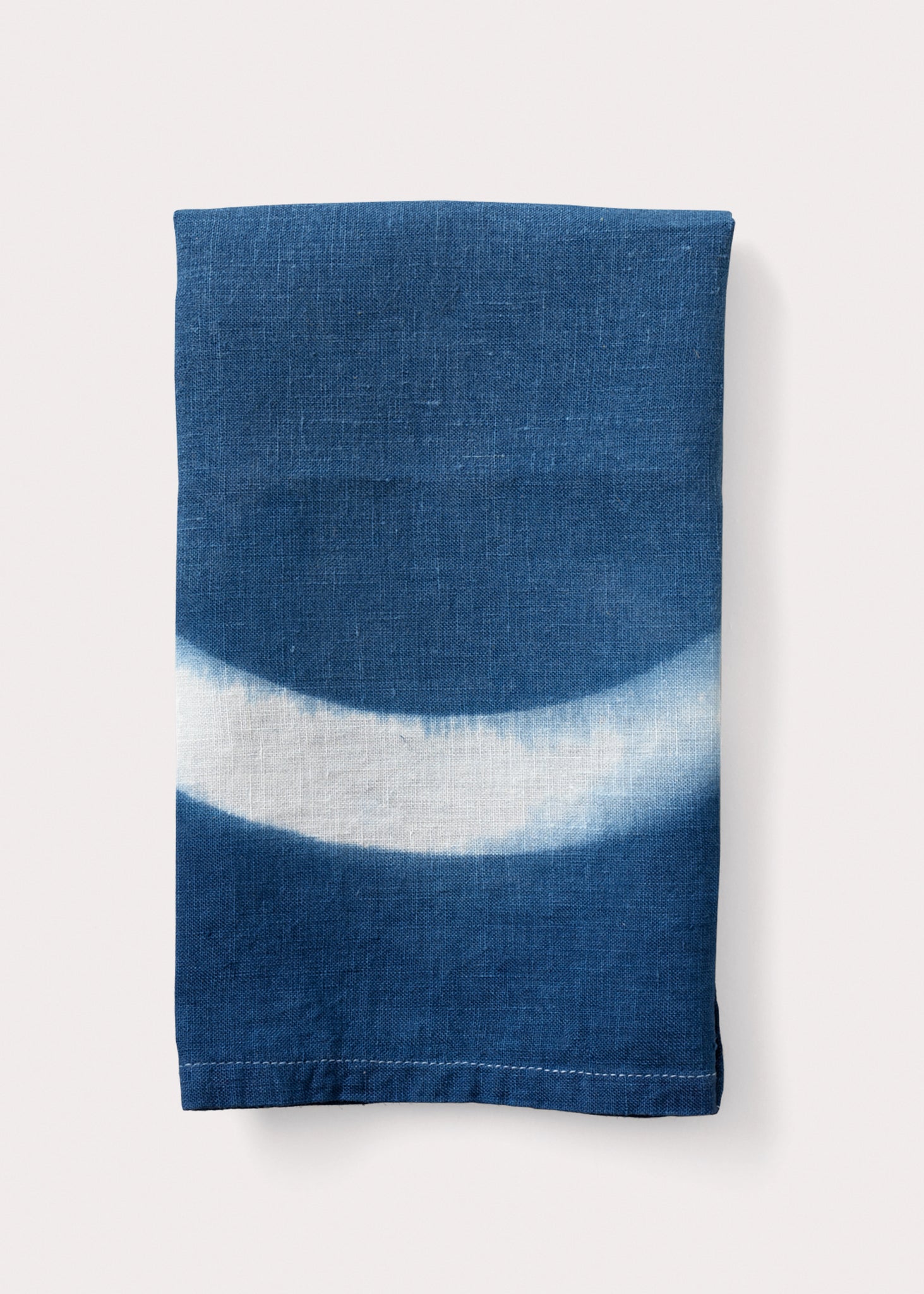 A square-shaped indigo altar cloth with a white circle in the center, displayed on a plain background.
