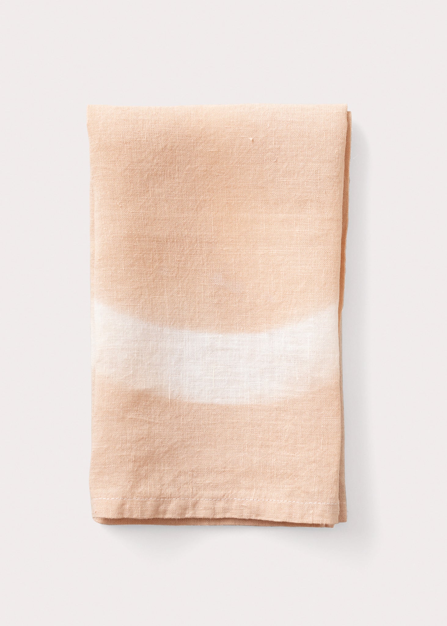 A peach-colored altar cloth with a white circle symbol on it, displayed against a light background.